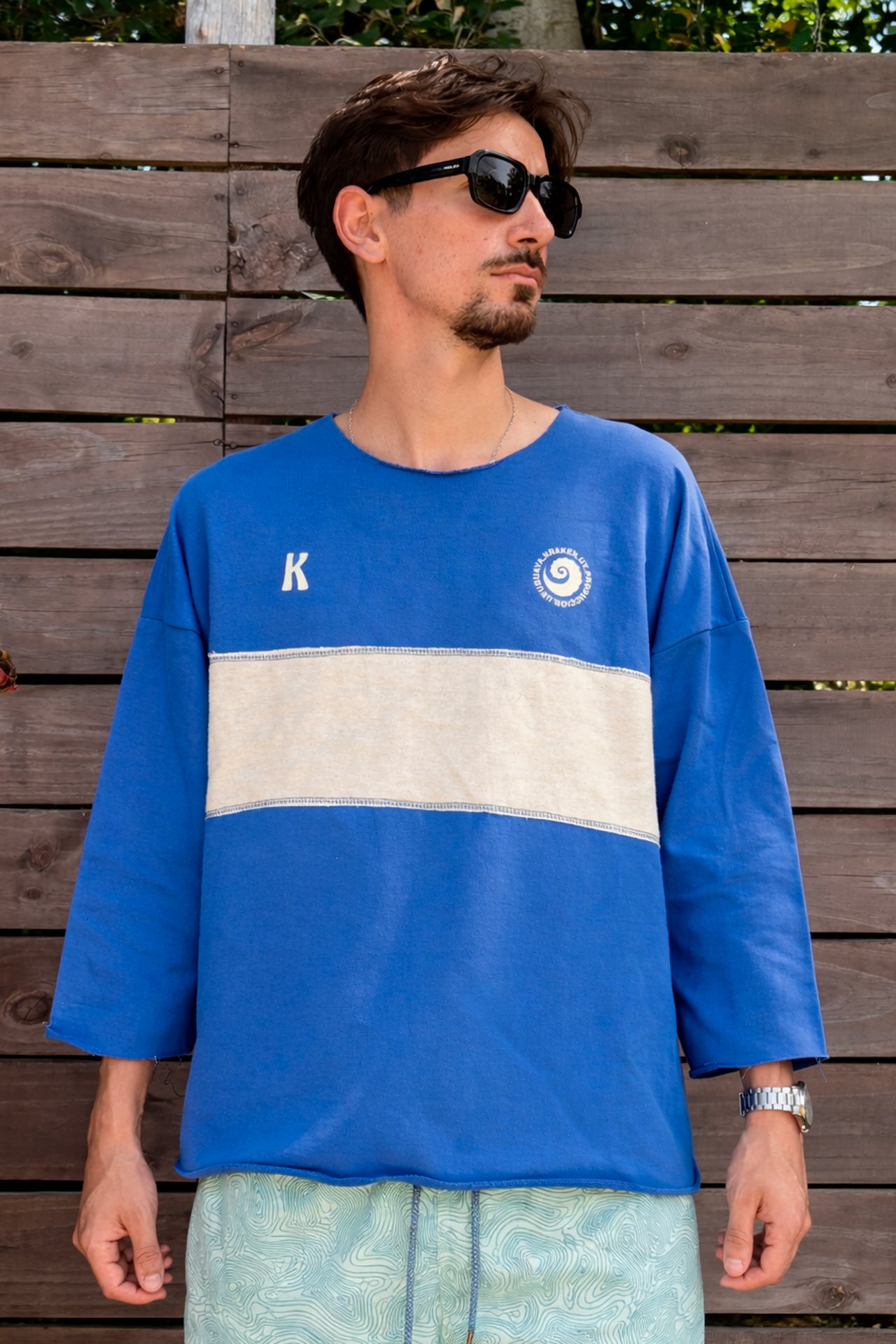 Poncho manga 3/4 azul y crudo